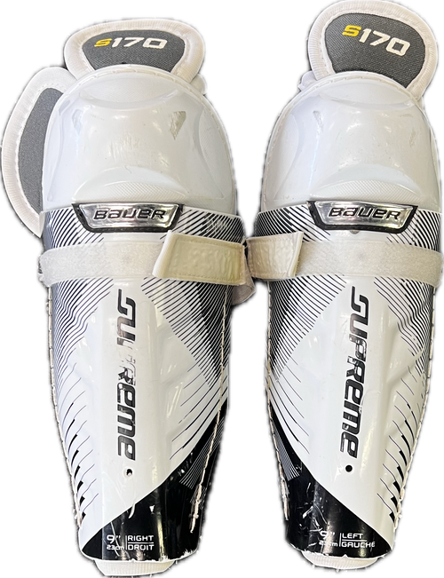 Vist Large View of Product Image Which is Used Bauer SUPREME S170 Youth Shin Guards Black And White 9"