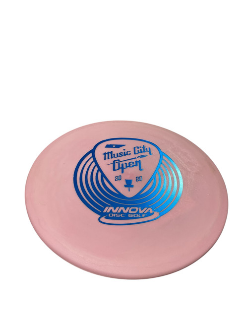 Vist Large View of Product Image Which is Used Innova MUSIC CITY OPEN Disc Golf Mid Range Pink