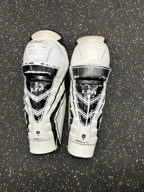 Vist Large View of Product Image Which is Used CCM LTP Junior Shin Guards White 11"