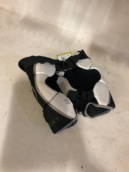 Vist Large View of Product Image Which is Used Warrior RABIL NEXT Lacrosse Arm Pads/Guards Black S/M