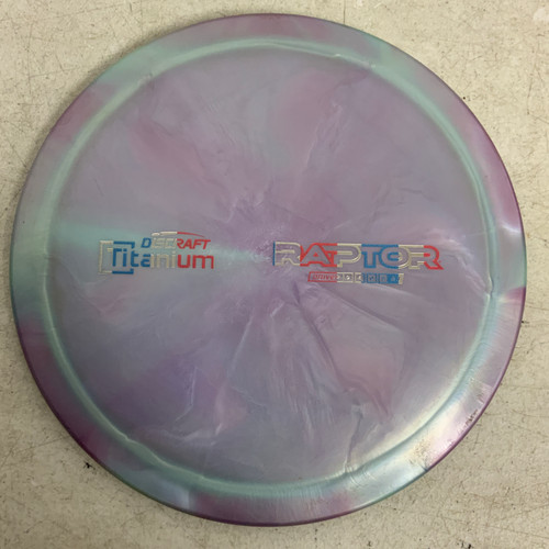 Vist Large View of Product Image Which is Used Discraft TITANIUM RAPTOR Disc Golf Mid Range Purple 176g