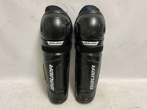 Vist Large View of Product Image Which is Used Bauer X Intermediate Shin Guards Black And Carolina Blue 14"
