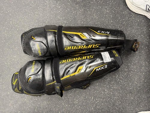 Vist Large View of Product Image Which is Used Bauer SUPREME TOTAL ONE MX3 DAMAGE Senior Shin Guards Black 16"