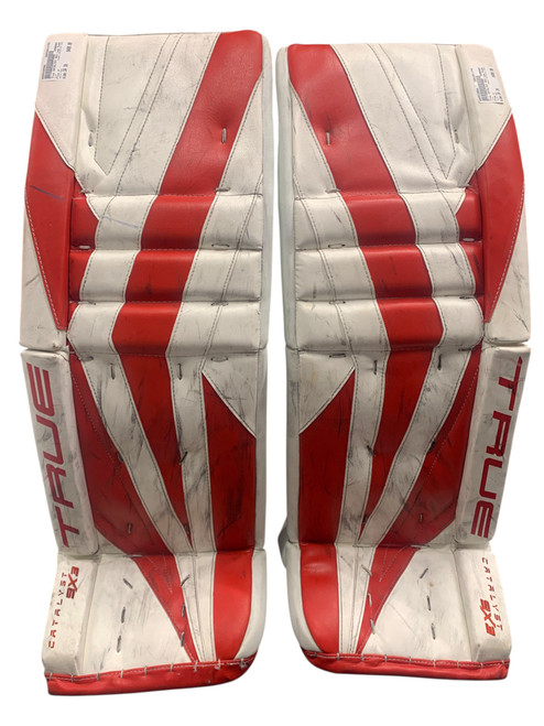 Vist Large View of Product Image Which is Used True CATALYST 9X3 Goalie Leg Pads Senior White/Red 34+2”