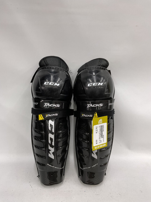 Vist Large View of Product Image Which is Used CCM BAUER TACKS 9550 SG 12IN Junior Shin Guards Black 12"