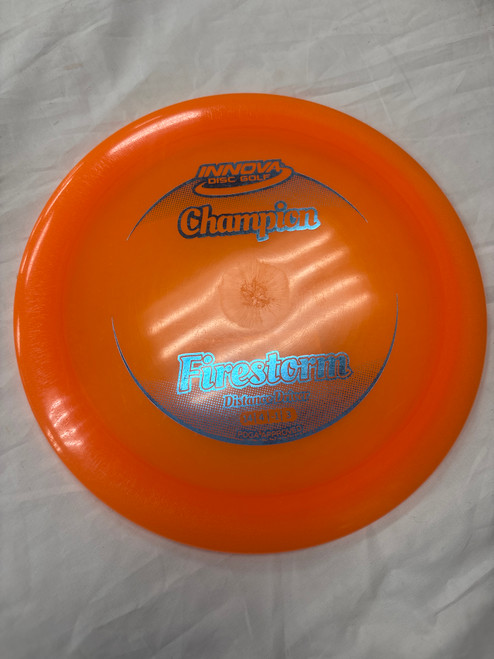 Vist Large View of Product Image Which is Used Innova FIRESTORM DRIVER Disc Golf Driver Orange