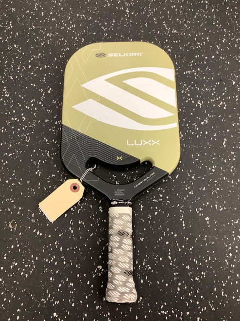Vist Large View of Product Image Which is Used Selkirk LUXX INVIKTA Pickleball Racquet Tan