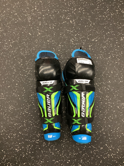 Vist Large View of Product Image Which is Used Bauer X Junior Shin Guards Black 10"