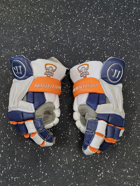 Vist Large View of Product Image Which is Used Warrior BURN NEXT Lacrosse Gloves Junior White And Orange MD