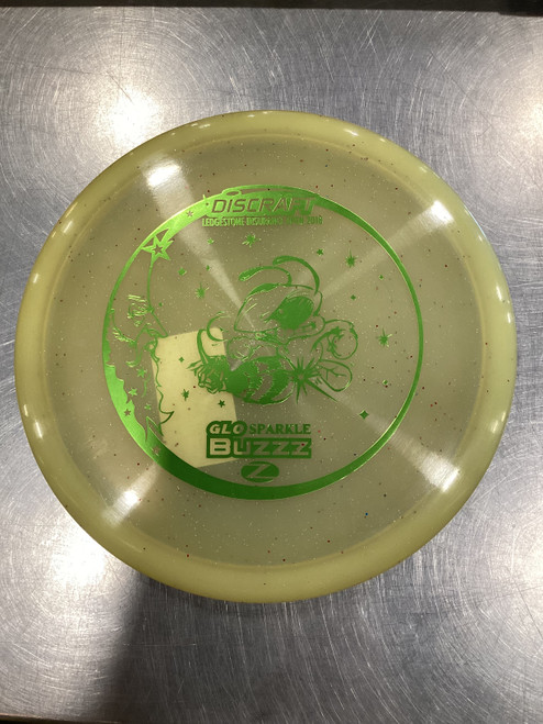 Vist Large View of Product Image Which is Used Discraft BUZZZ Disc Golf Mid Range Cream White