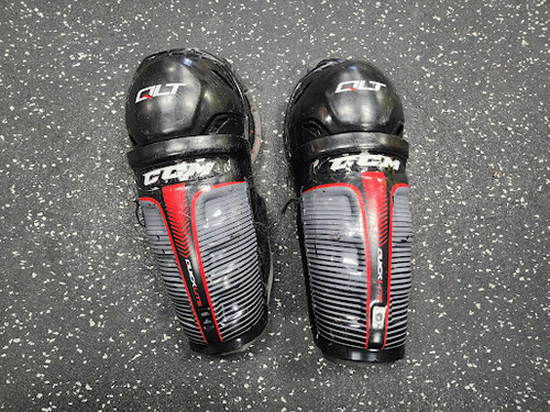 Vist Large View of Product Image Which is Used CCM QLT Youth Shin Guards Black 8"