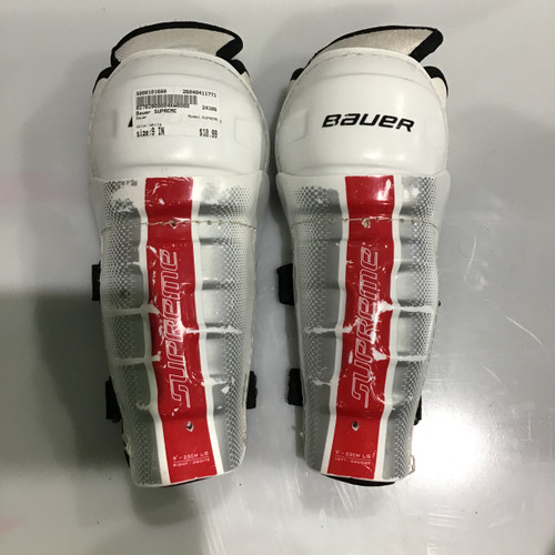 Vist Large View of Product Image Which is Used Bauer SUPREME Youth Shin Guards White 9"
