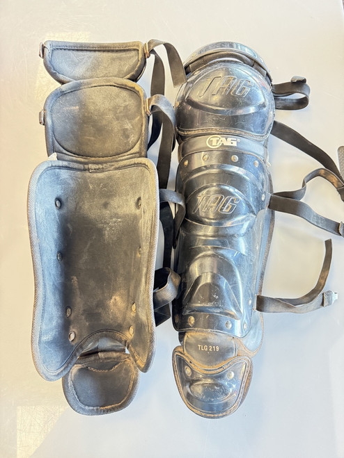 Vist Large View of Product Image Which is Used TAG TLG 219 Catchers Leg Guards Black Adult