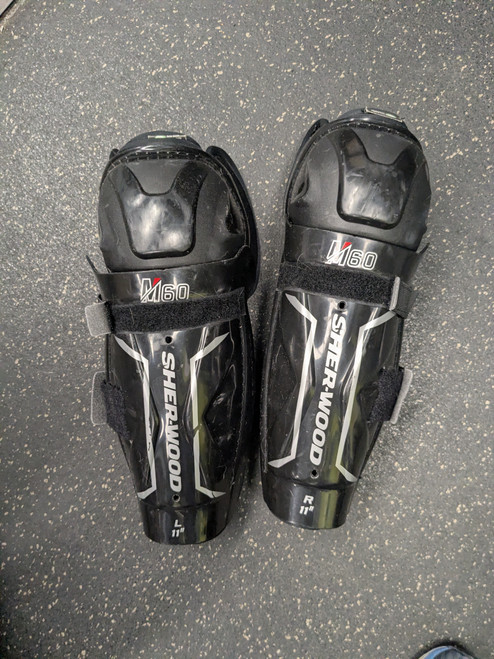 Vist Large View of Product Image Which is Used Sher-wood M60 SG Junior Shin Guards Black 11"