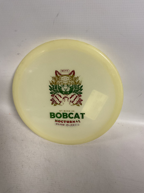 Vist Large View of Product Image Which is Used MINT DISCS NOCTURNAL GLOW BOBCAT Disc Golf Mid Range Tan
