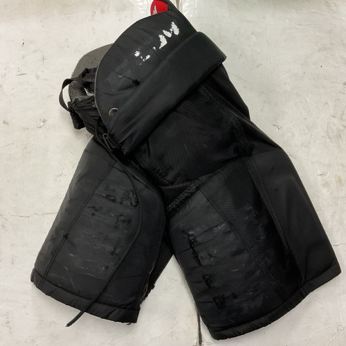 Vist Large View of Product Image Which is Used CCM JR BREEZERS Junior Pant Black And Red MD