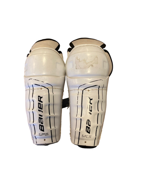 Vist Large View of Product Image Which is Used Bauer SUPREME Youth Shin Guards White 8"