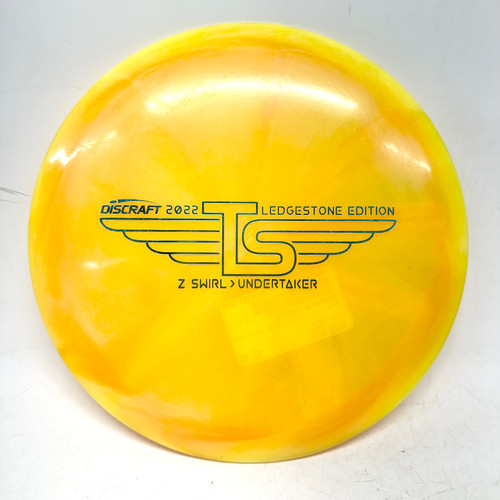 Vist Large View of Product Image Which is Used Discraft Z SWIRL UNDERTAKER Disc Golf Driver Gold 173g