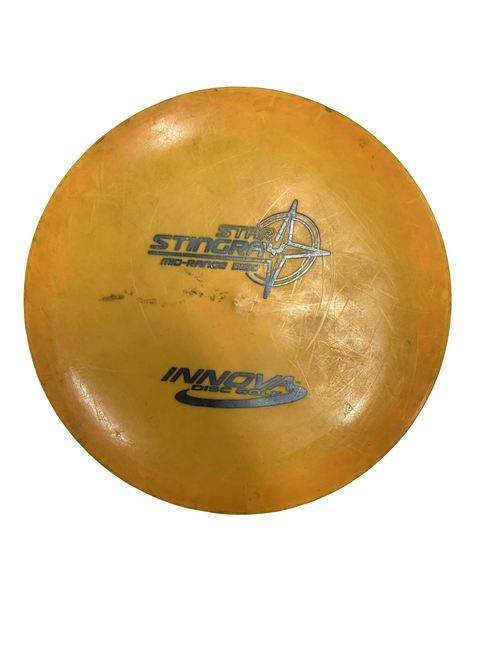 Vist Large View of Product Image Which is Used Innova STING RAY Disc Golf Mid Range Orange