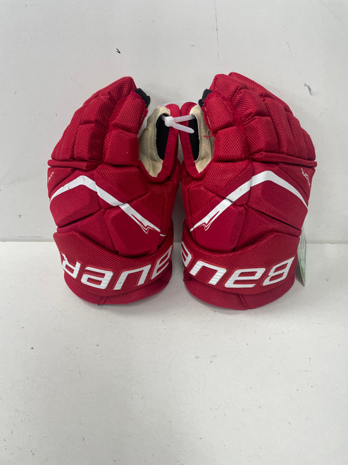 Vist Large View of Product Image Which is Used Bauer VAPOR FLY PRO Junior Gloves Red 12"