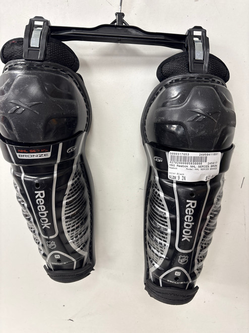Vist Large View of Product Image Which is Used Reebok NHL SERIES BRONZE Youth Shin Guards Black 9"
