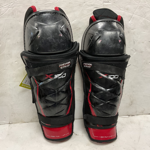 Vist Large View of Product Image Which is Used Bauer VAPOR X100 Senior Shin Guards Black And Red 14"