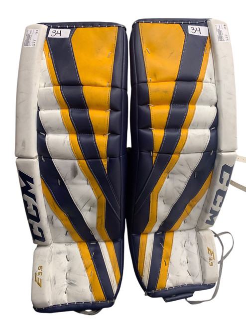 Vist Large View of Product Image Which is Used CCM E3.9 Goalie Leg Pads Senior White/Sport Gold/Navy 34+1”