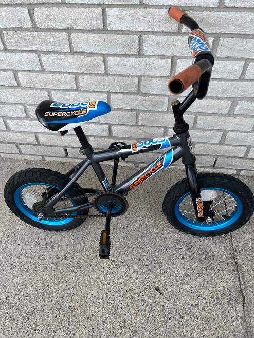 Vist Large View of Product Image Which is Used Supercycle EDGE Cruiser Bike Boys Royal Blue 12"