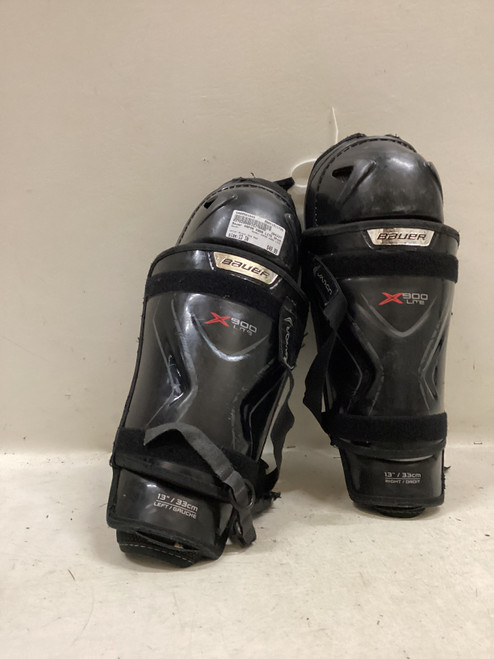 Vist Large View of Product Image Which is Used Bauer VAPOR X900 LITE Senior Shin Guards Black And Red 13"