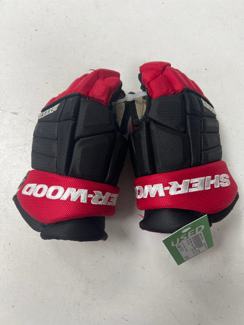 Vist Large View of Product Image Which is Used Sher-wood REKKER M70 Junior Gloves Black And Red 10"