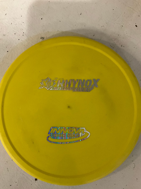 Vist Large View of Product Image Which is Used Innova XTRHYNOX Disc Golf Putter Yellow