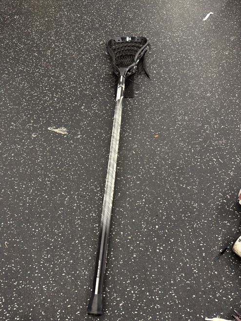 Vist Large View of Product Image Which is Used Under Armour NEXGEN Men Atk/Mid Complete Stick Black