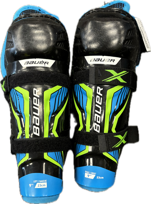 Vist Large View of Product Image Which is Used Bauer X Junior Shin Guards Royal Blue 9"