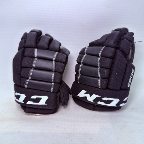Vist Large View of Product Image Which is Used CCM EDGE Youth Gloves Black 9"