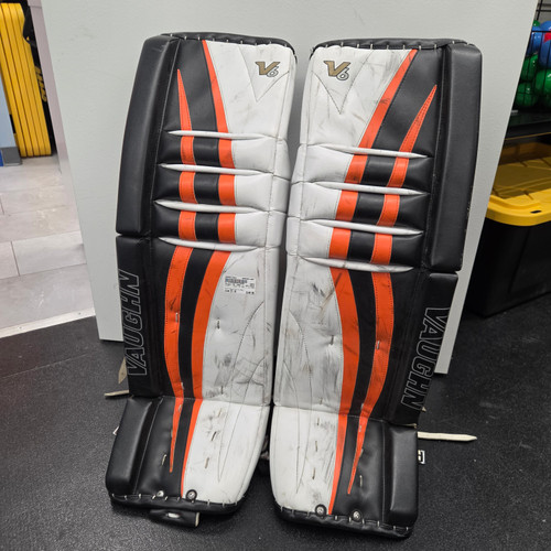 Vist Large View of Product Image Which is Used Vaughn V6 1000 +1 LEG PADS Goalie Leg Pads Senior Black And Orange 35"