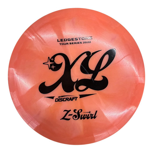 Vist Large View of Product Image Which is Used Discraft LEDGESTONE Z-SWIRL XL Disc Golf Driver Orange 172g