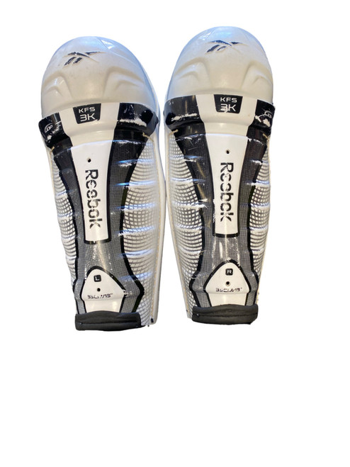 Vist Large View of Product Image Which is Used Reebok KFS3K Junior Shin Guards White 13"