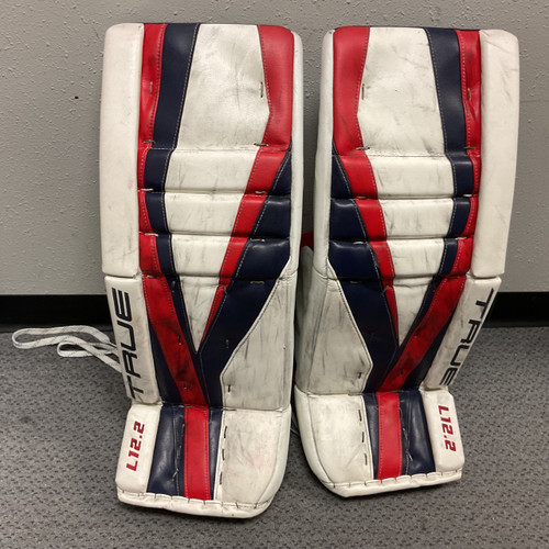 Vist Large View of Product Image Which is Used True 12.2 Goalie Leg Pads Intermediate White/Red/Navy 32"