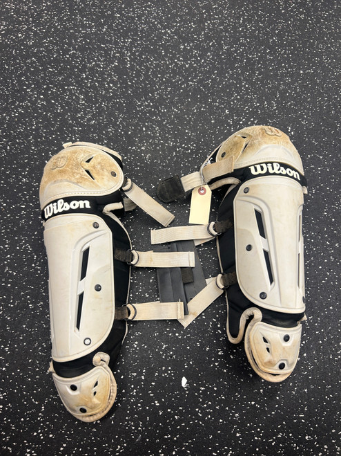 Vist Large View of Product Image Which is Used Wilson Catchers Leg Guards White Youth