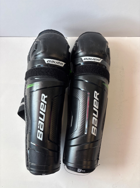 Vist Large View of Product Image Which is Used Bauer X Junior Shin Guards Black 12"