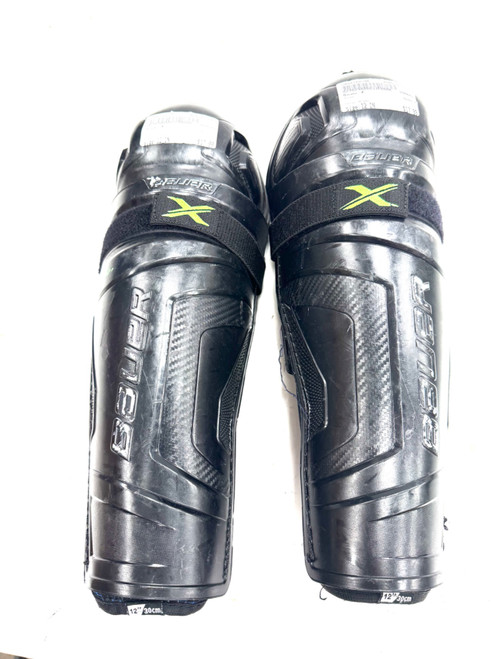 Vist Large View of Product Image Which is Used Bauer X Junior Shin Guards Black 12"