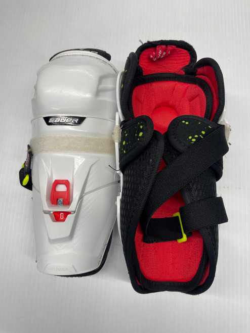 Vist Large View of Product Image Which is Used Bauer XTENO Youth Shin Guards White 9"