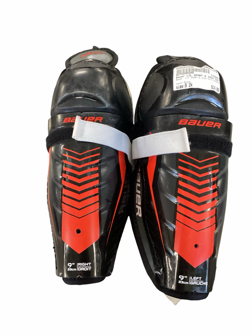 Vist Large View of Product Image Which is Used Bauer LIL SPORT 9 INCH SHIN GAURDS Junior Shin Guards Black 9"