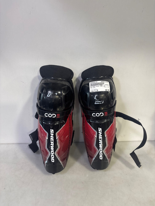 Vist Large View of Product Image Which is Used Sher-wood CODE Junior Shin Guards Black 11"