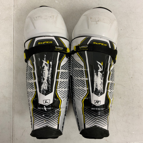Vist Large View of Product Image Which is Used CCM SUPER TACK Junior Shin Guards White 12"