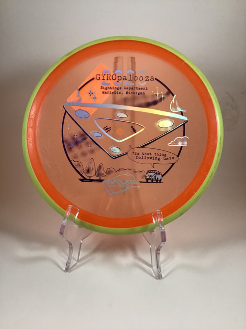 Vist Large View of Product Image Which is Used Axiom PRISM PROTON PYRO Disc Golf Mid Range Orange 177g