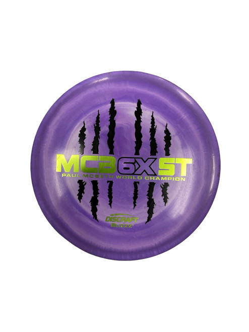 Vist Large View of Product Image Which is Used Discraft ESP BUZZZ MCBETH BX Disc Golf Mid Range Purple 180g