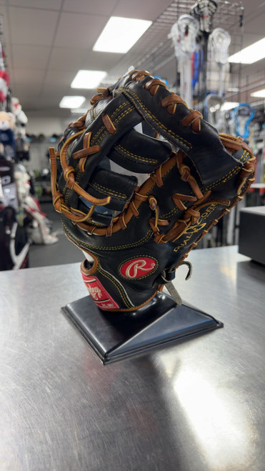 Vist Large View of Product Image Which is Used Rawlings HEART OF THE HIDE 1B BB/SB First Base RH Throw Black 13"