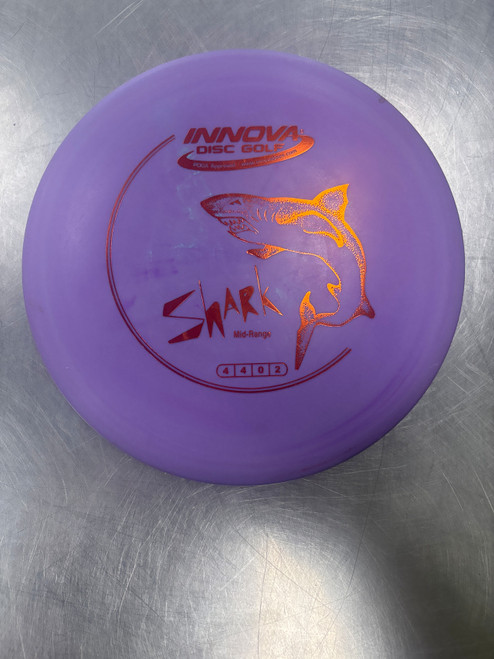 Vist Large View of Product Image Which is Used Innova DX SHARK Disc Golf Mid Range Purple
