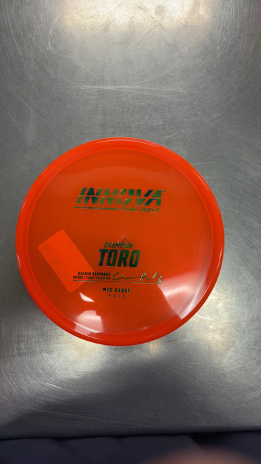 Vist Large View of Product Image Which is Used Innova CHAMPION TORO Disc Golf Mid Range Orange